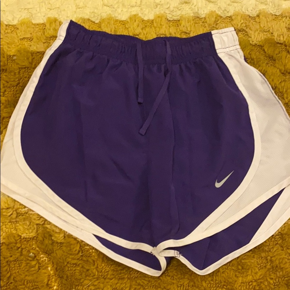 Purple and white NIKE running shorts